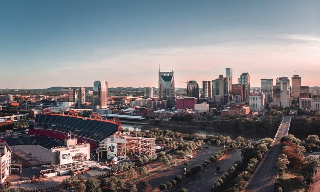 Nashville skyline with stadium at sunset.