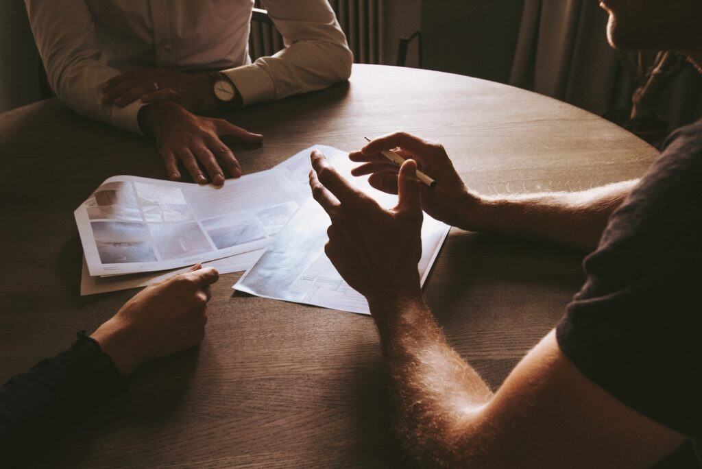 Collaborative meeting with documents on table