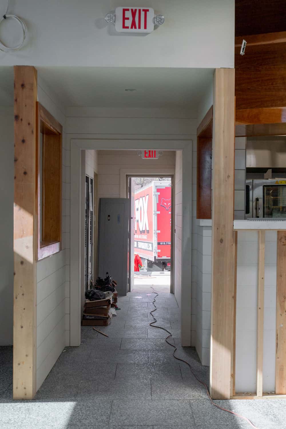 picture is made from the empty property, we also see a moving truck of fox moving and storage standing outside the property